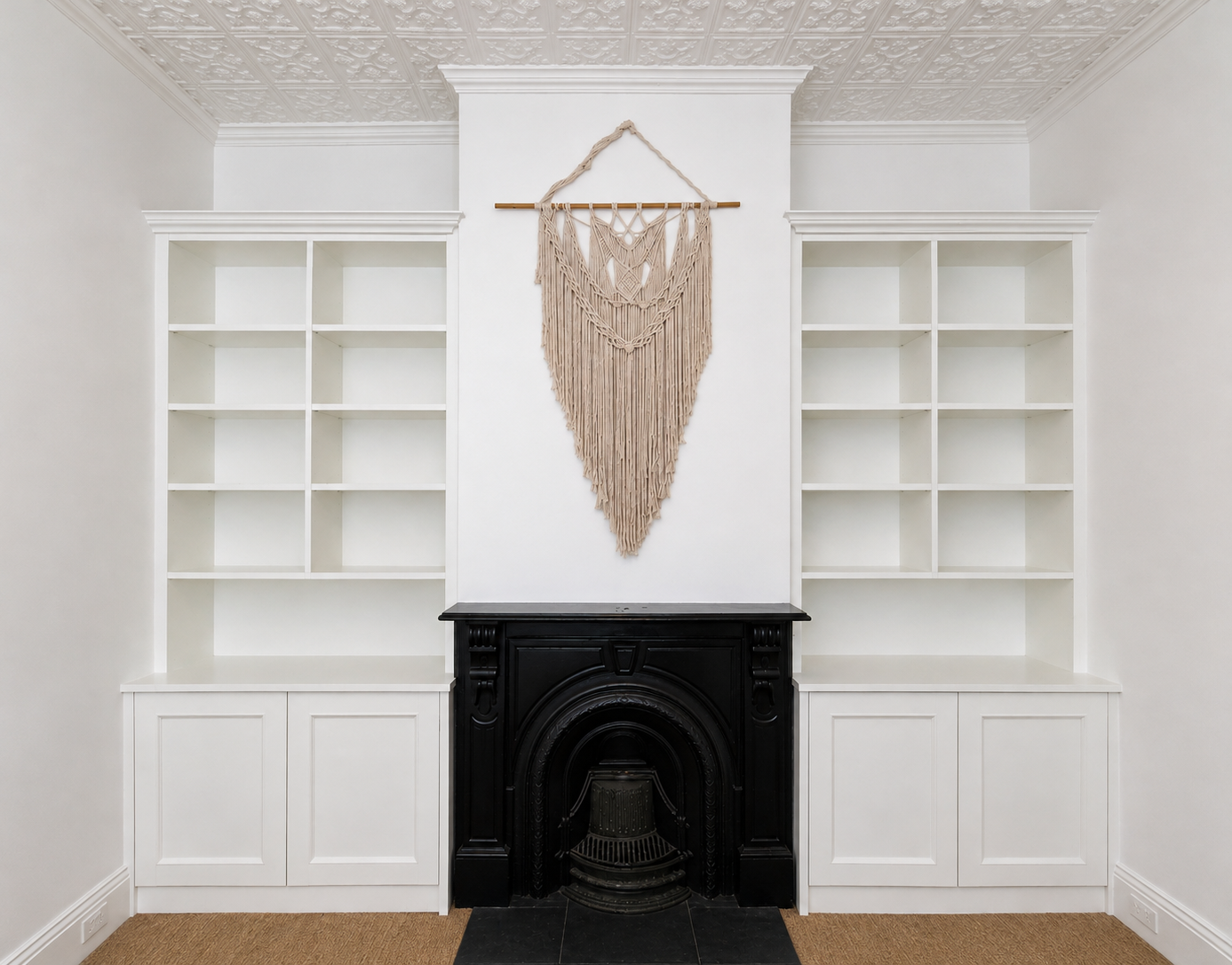 Custom built-in cabinetry around a fireplace in a Melbourne home